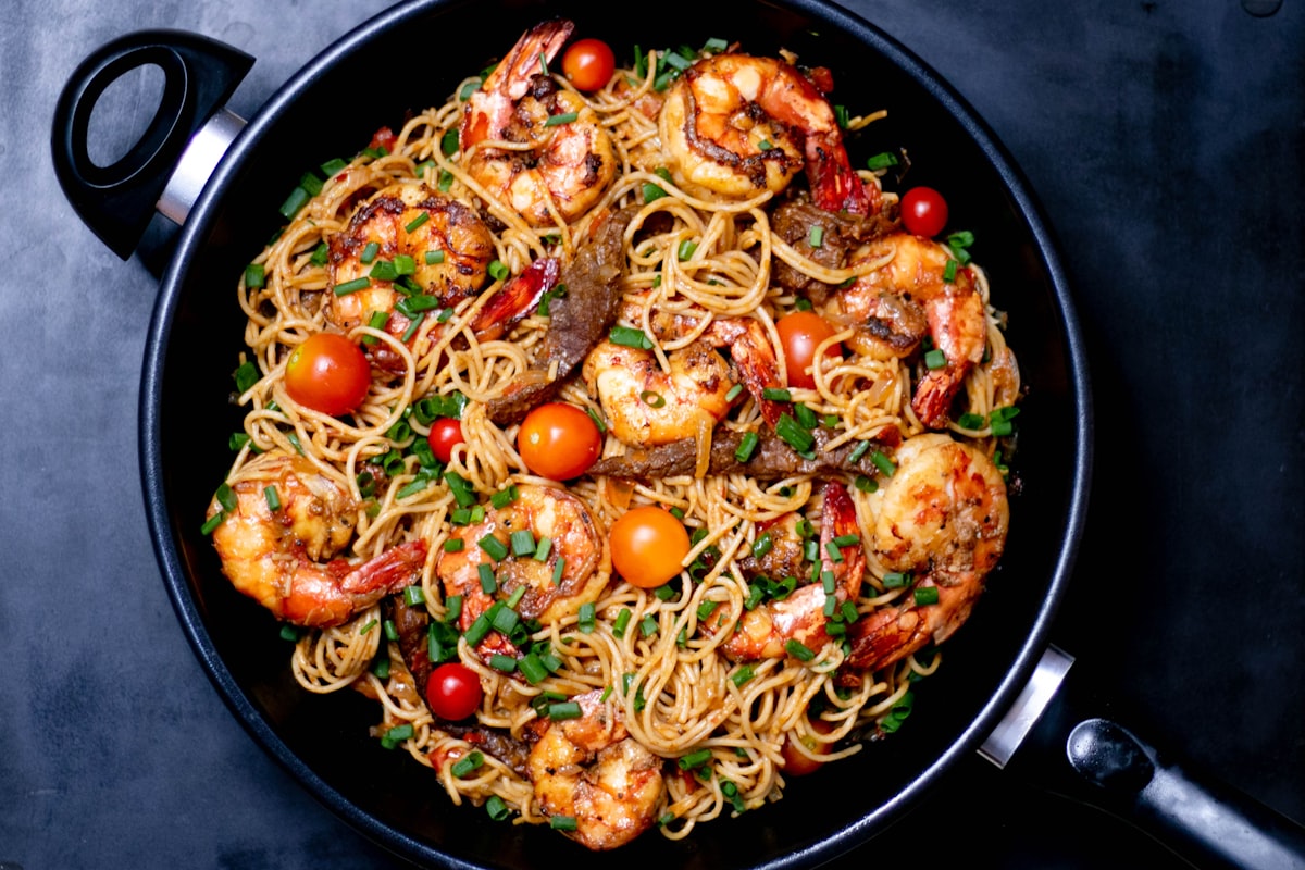 Bowl of pasta with garlic butter shrimp and parsley