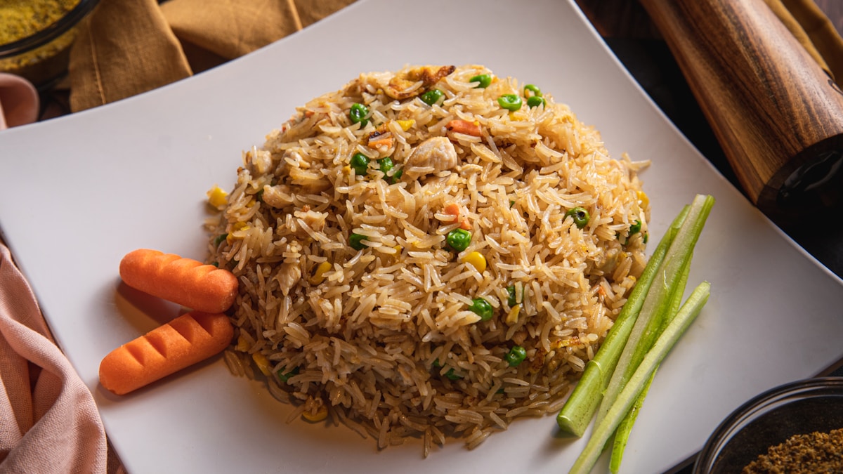 Fried rice with egg and vegetables in a skillet